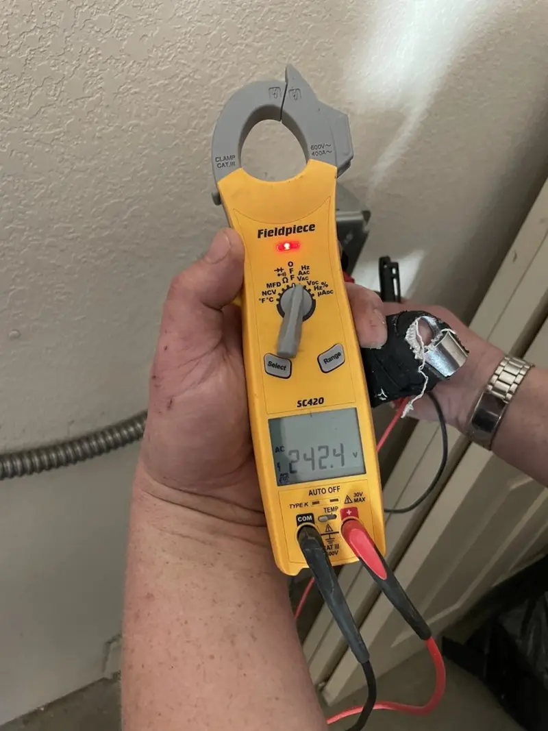 Voltage testing with clamp meter during Ceiling Fan Installation in Rockdale